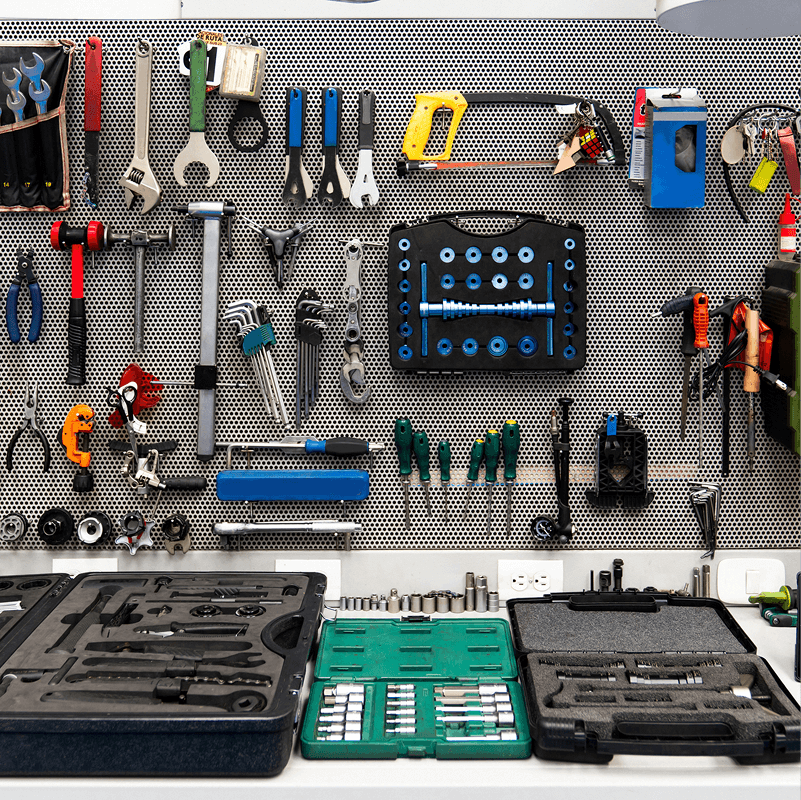 Neatly arranged tools on a workshop wall