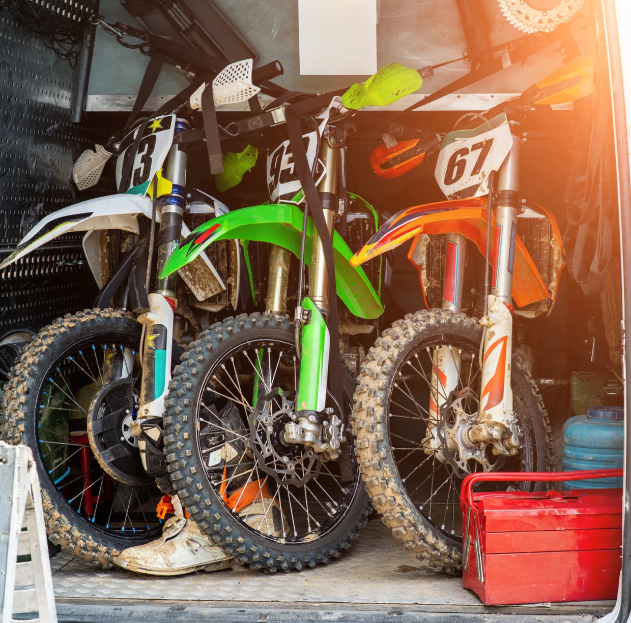 Dirt bikes in a transport vehicle.