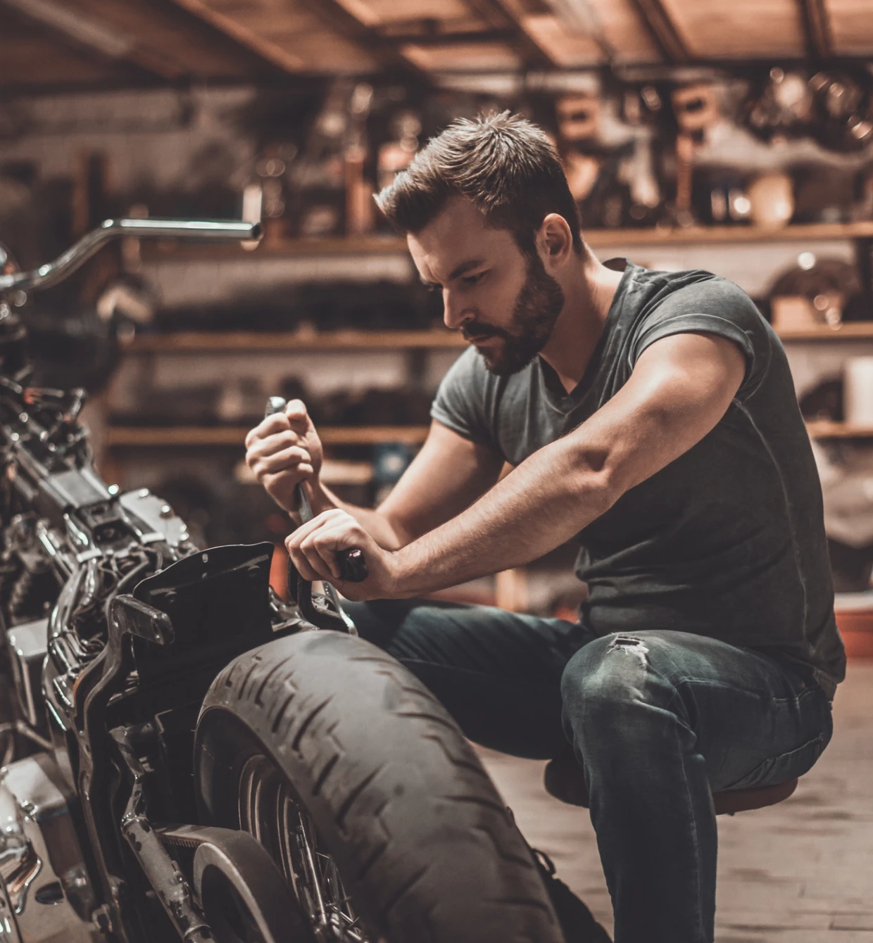 Focused on motorcycle maintenance task